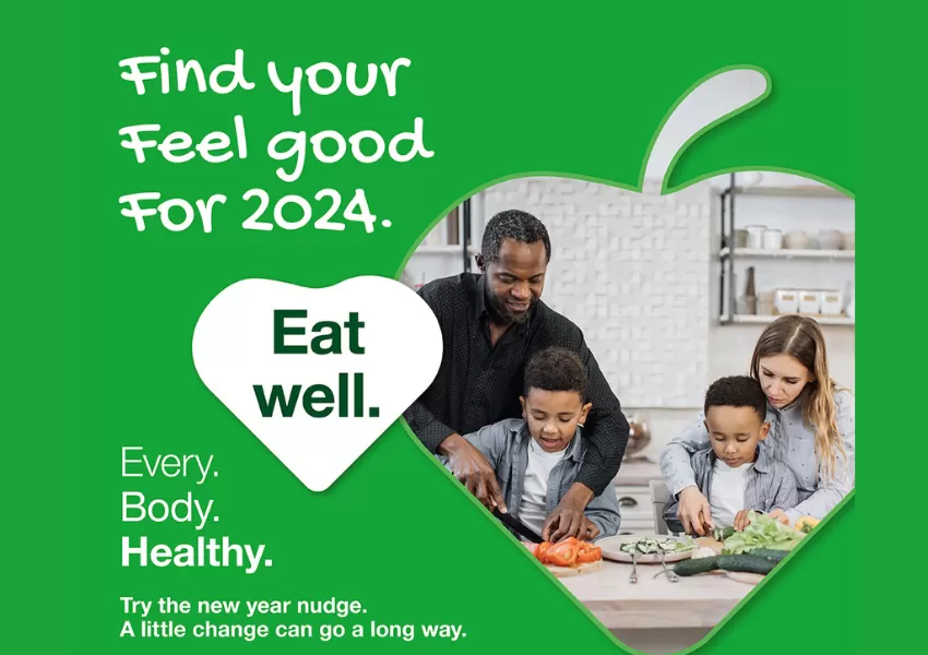 Find your feel good 2024 - eat well. Image of family cooking together.