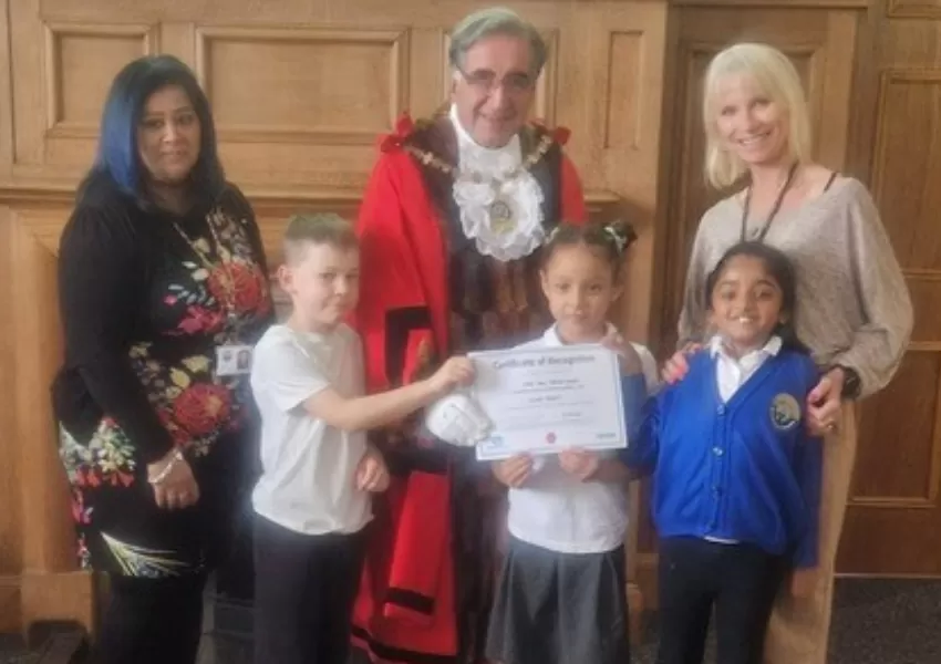 Pupils and staff receiving award from the Mayor of Barnet