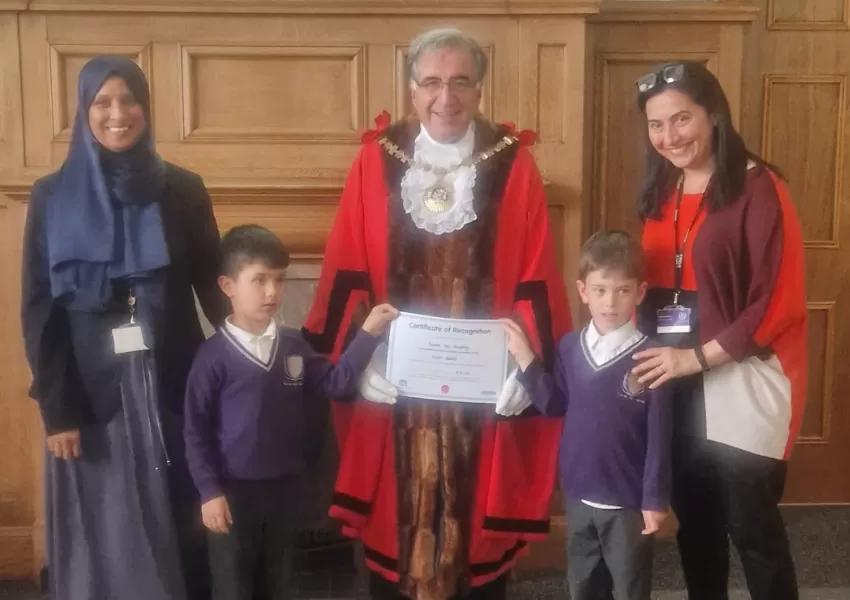 Pupils and staff receiving award from the Mayor of Barnet