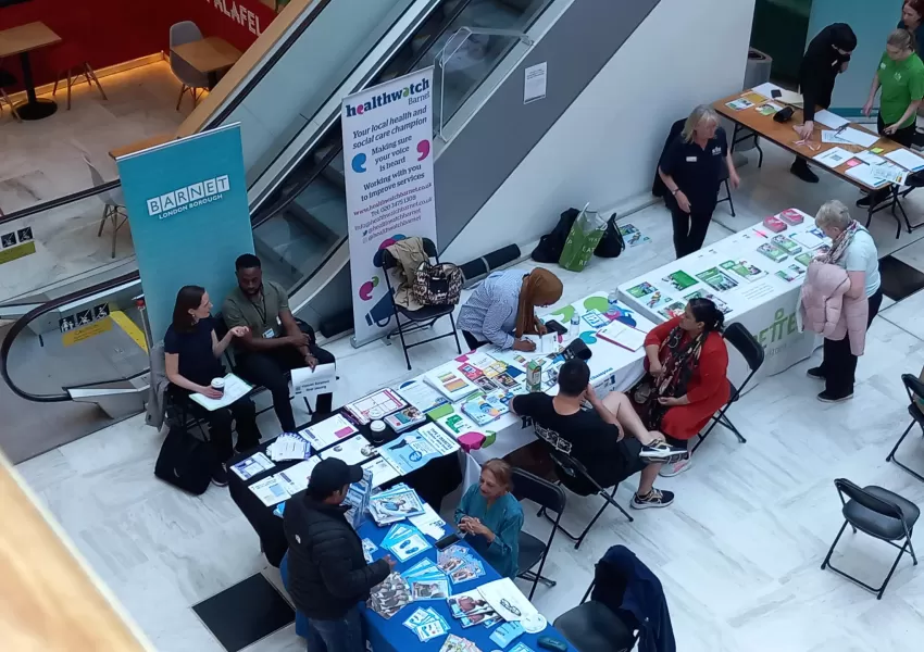 Picture of stallholders talking to residents at the diabetes week event