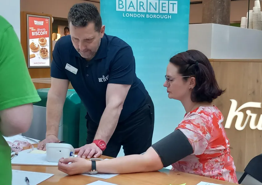 A person receiving a blood pressure check