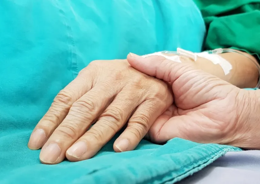 A hand on another hand.