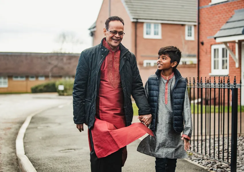 A father and son walking to school