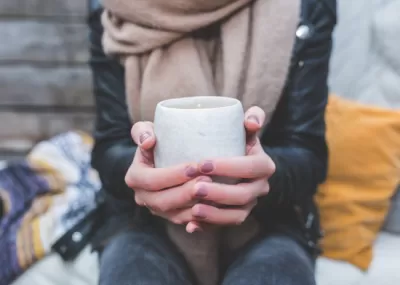 hands holding a hot drink