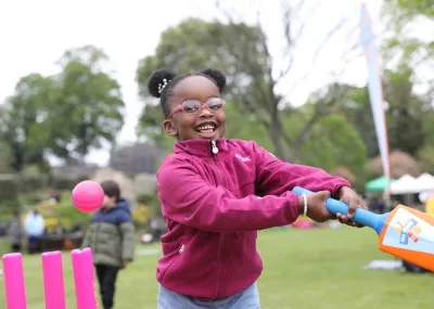 child playing cricket