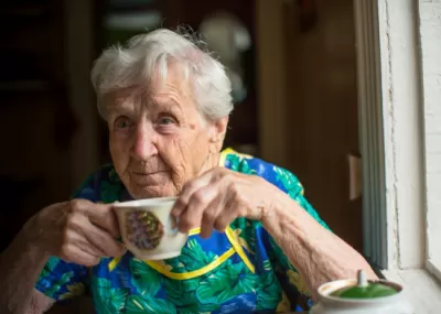 Older woman drinking tea