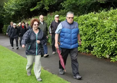 Group of people walking together in a park