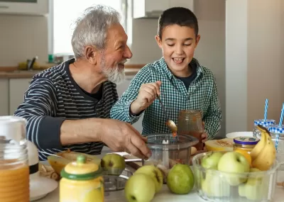 Grandad and child eating apples