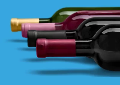 wine bottles lying on their side on a blue background