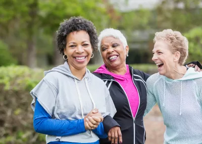 Picture of a group of females smiling together.