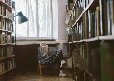 Woman reading in library