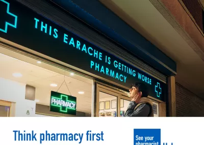 A person is standing outside a pharmacy holding the side of their face in discomfort. The sign above the pharmacy reads 'This earache is getting worse pharmacy'   A lower third box features in the bottom on the image. Text in the box reads: 'Think pharmacy first. Subject to age eligibility, including 12 years and over for sinusitis prescription medicine. Service available at majority of pharmacies.'