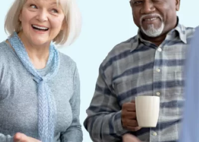 Two people having a chat and a cup of coffee.