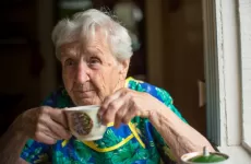 Older woman drinking cup of tea